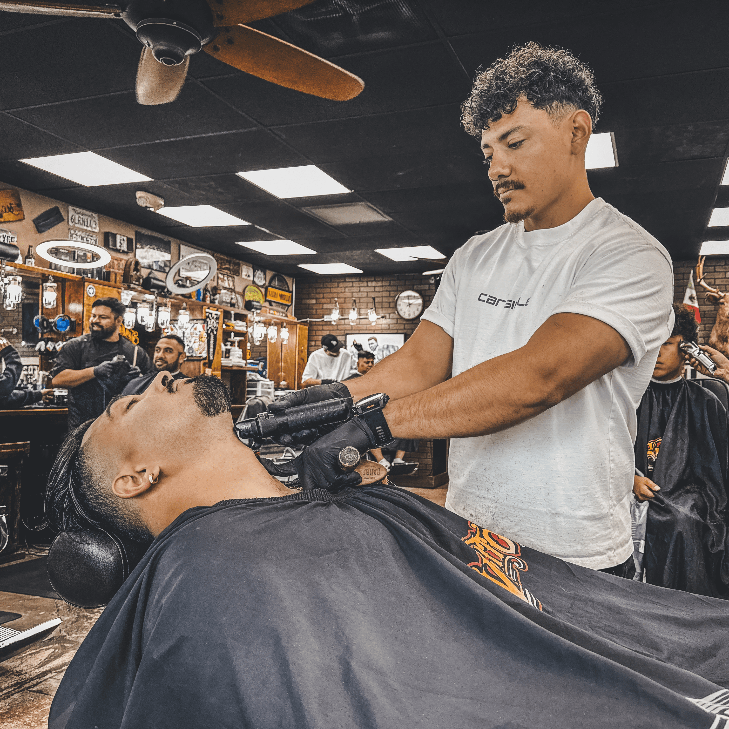 Beard trimming service by Osiel Campos Jr. at Hermanos Barbershop in Cypress